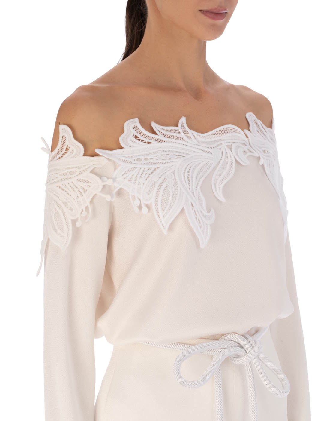 Belinda Blouse White with ornate Guipure lace detailing on the shoulders and cut-out accents, displayed on a plain background.