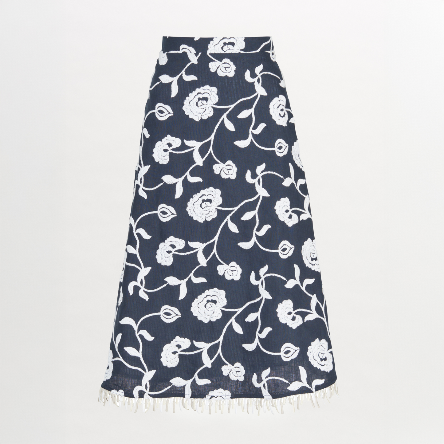 A Bianca Skirt Navy Embroidered with fringes in blue and white floral design.