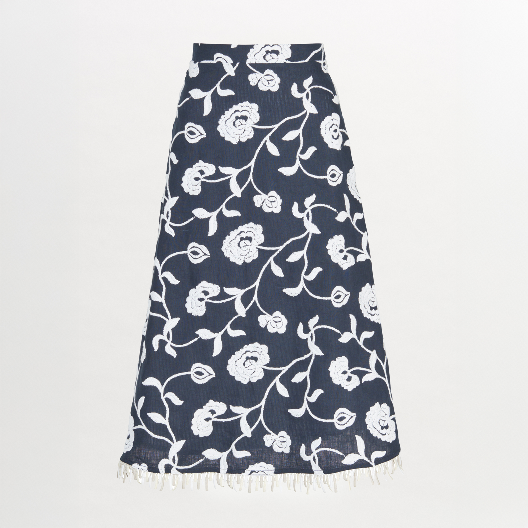 A Bianca Skirt Navy Embroidered with fringes in blue and white floral design.
