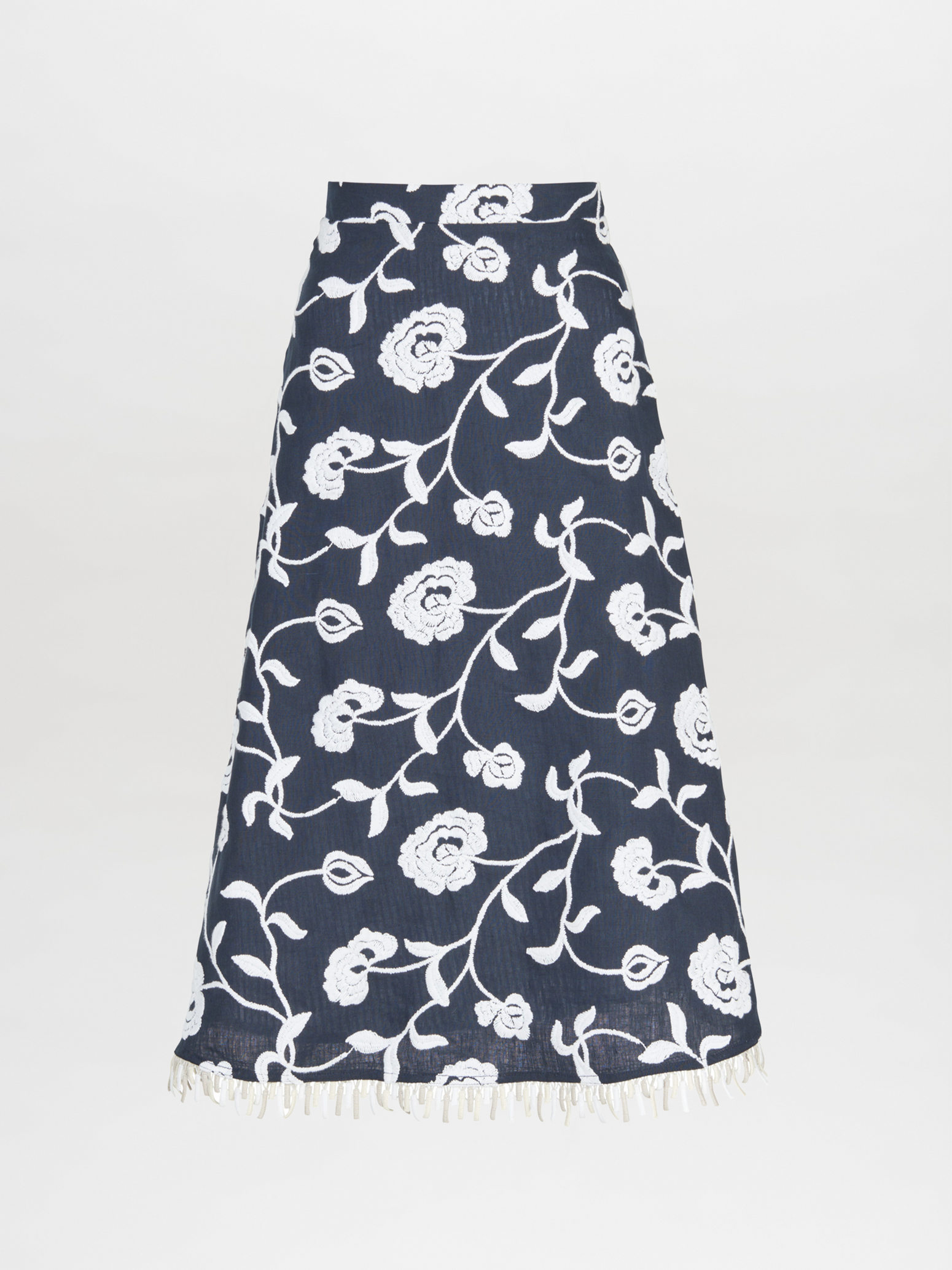 A Bianca Skirt Navy Embroidered with fringes in blue and white floral design.