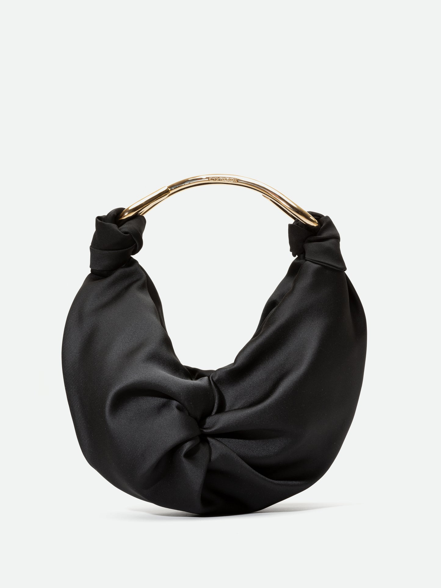 The Sofia Bag (Small) Black features a unique knotted top design and a metallic handle. Available for pre-order now, and it will ship by November 15.