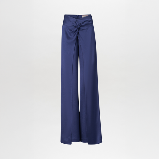 The Canturipe Pant, a pair of blue satin high-waisted pants, features a wide-leg silhouette with ruched detailing at the waist against a plain white background.