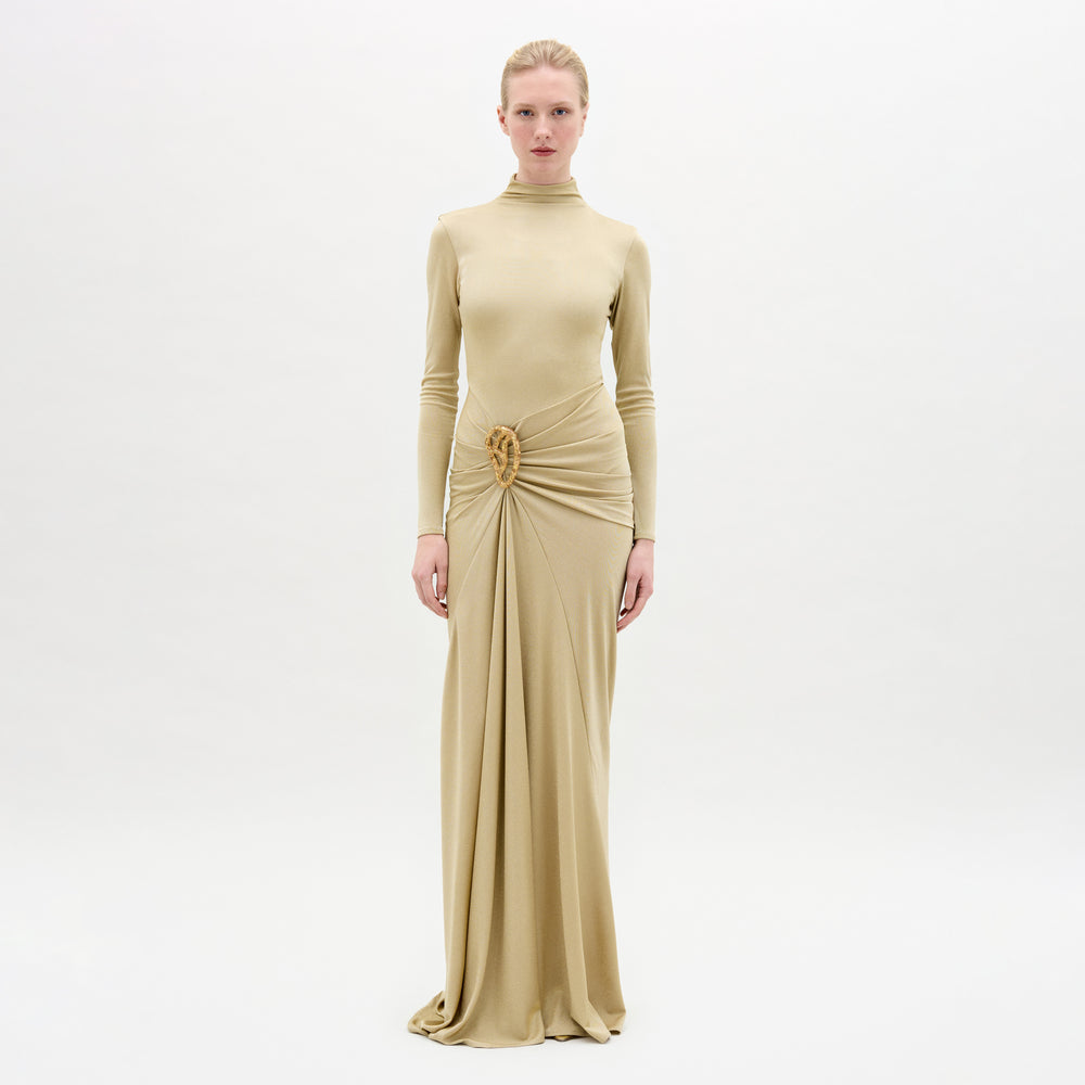 A woman wearing the Celinda Dress in color Gold  on a white background