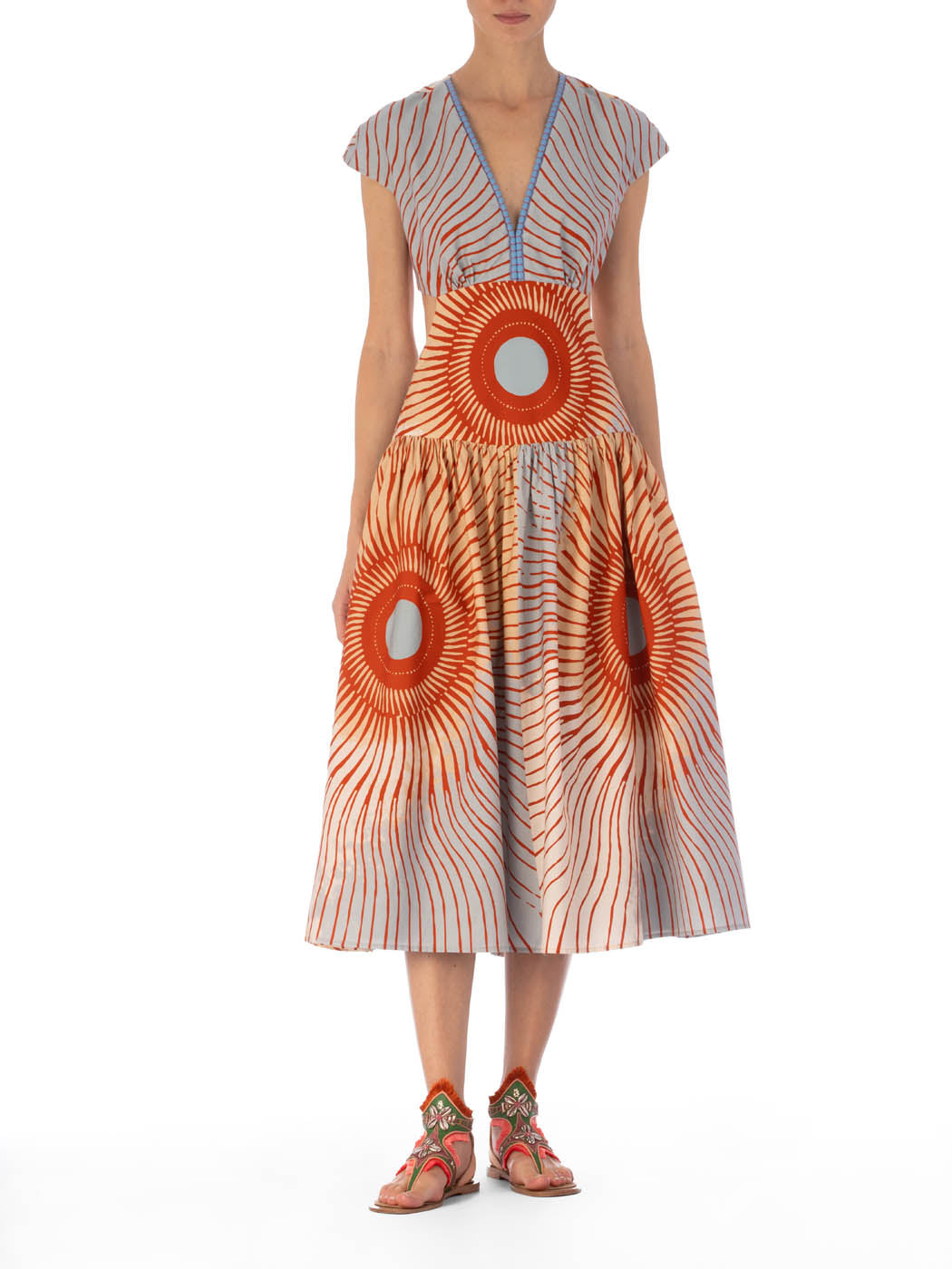 A colorful Cecile Dress Sausalito Sunset with short sleeves and a V neckline featuring a multicolor pattern with circular and wavy line designs.