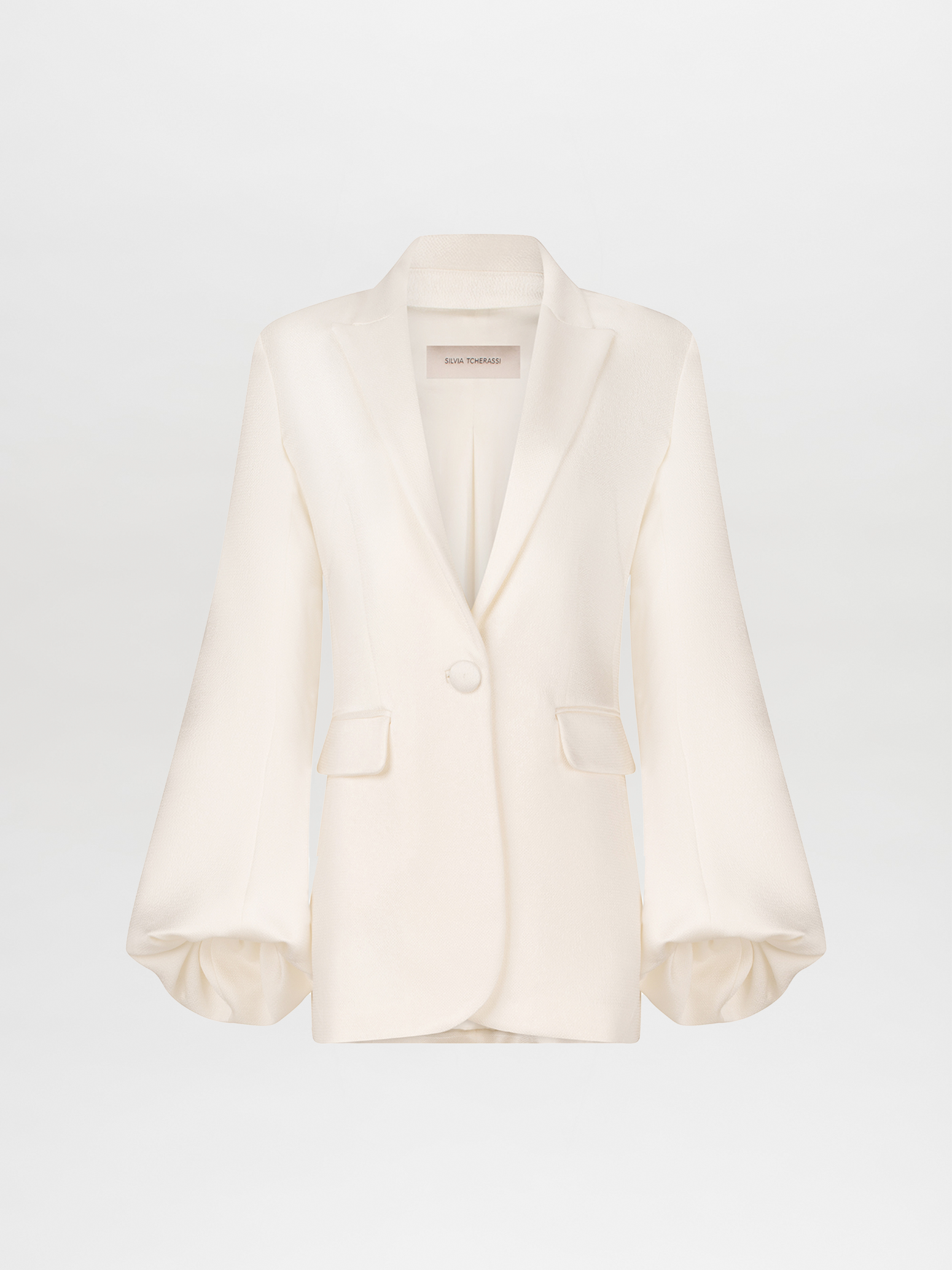 Elegant Coco Blazer White with a single button closure and puffed sleeves, crafted from textured hammered satin, isolated on a white background.