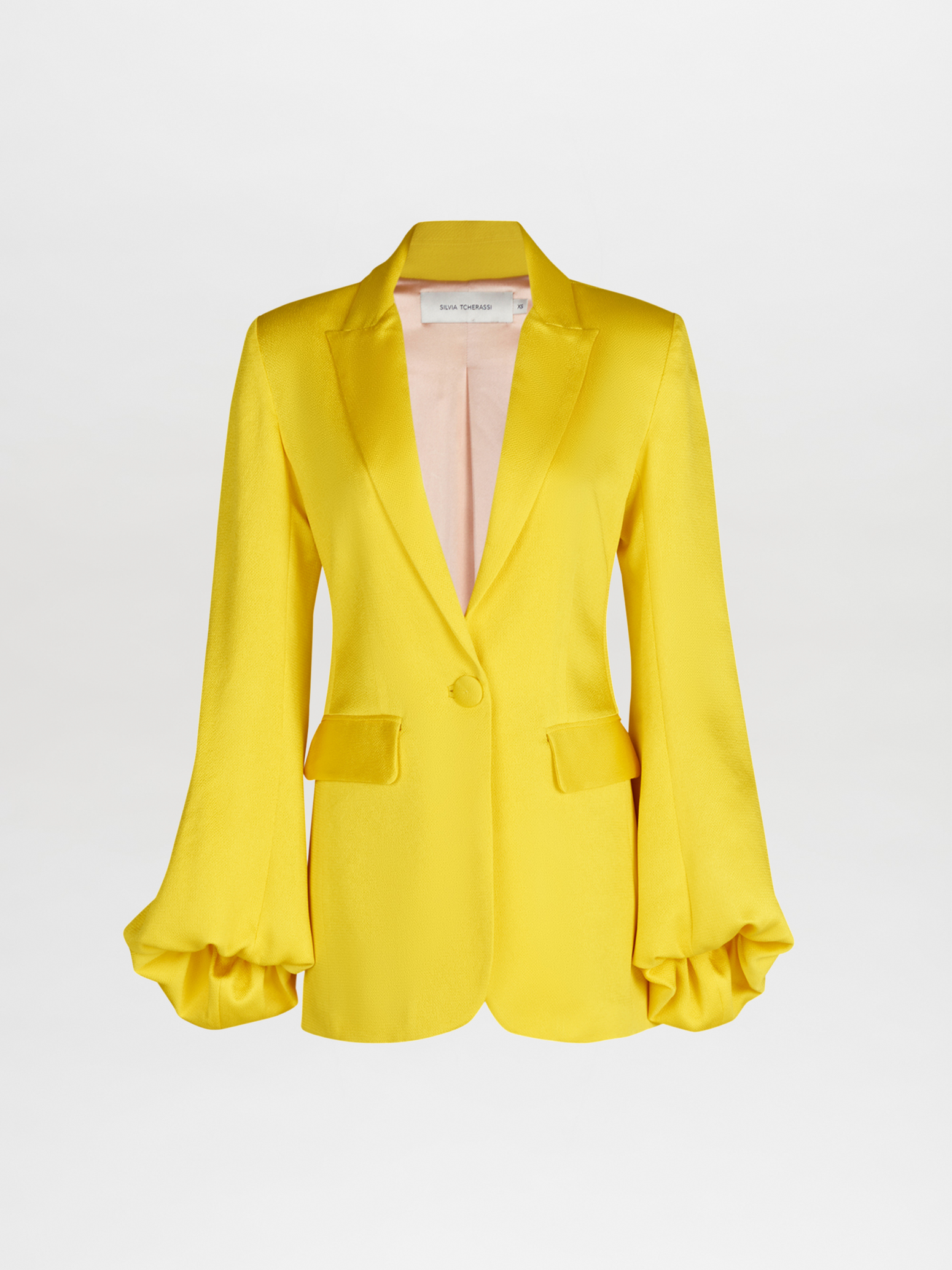 A Coco Blazer Yellow with satin ruffled sleeves.