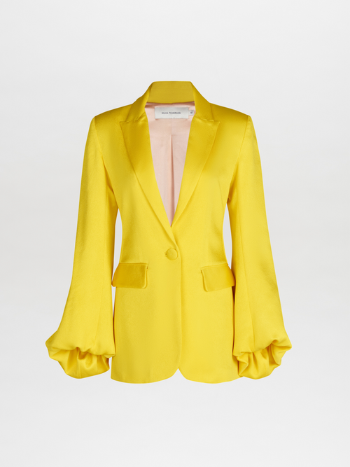 A Coco Blazer Yellow with satin ruffled sleeves.