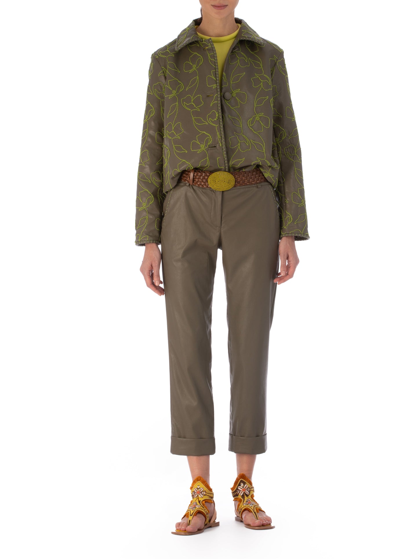 Explore the Columba Jacket in Forest Green, crafted from embroidered ecoleather. It showcases lime green floral embroidery, a chic collar, a button-down front, and long sleeves for an elegant mix of classic style with striking embroidery.