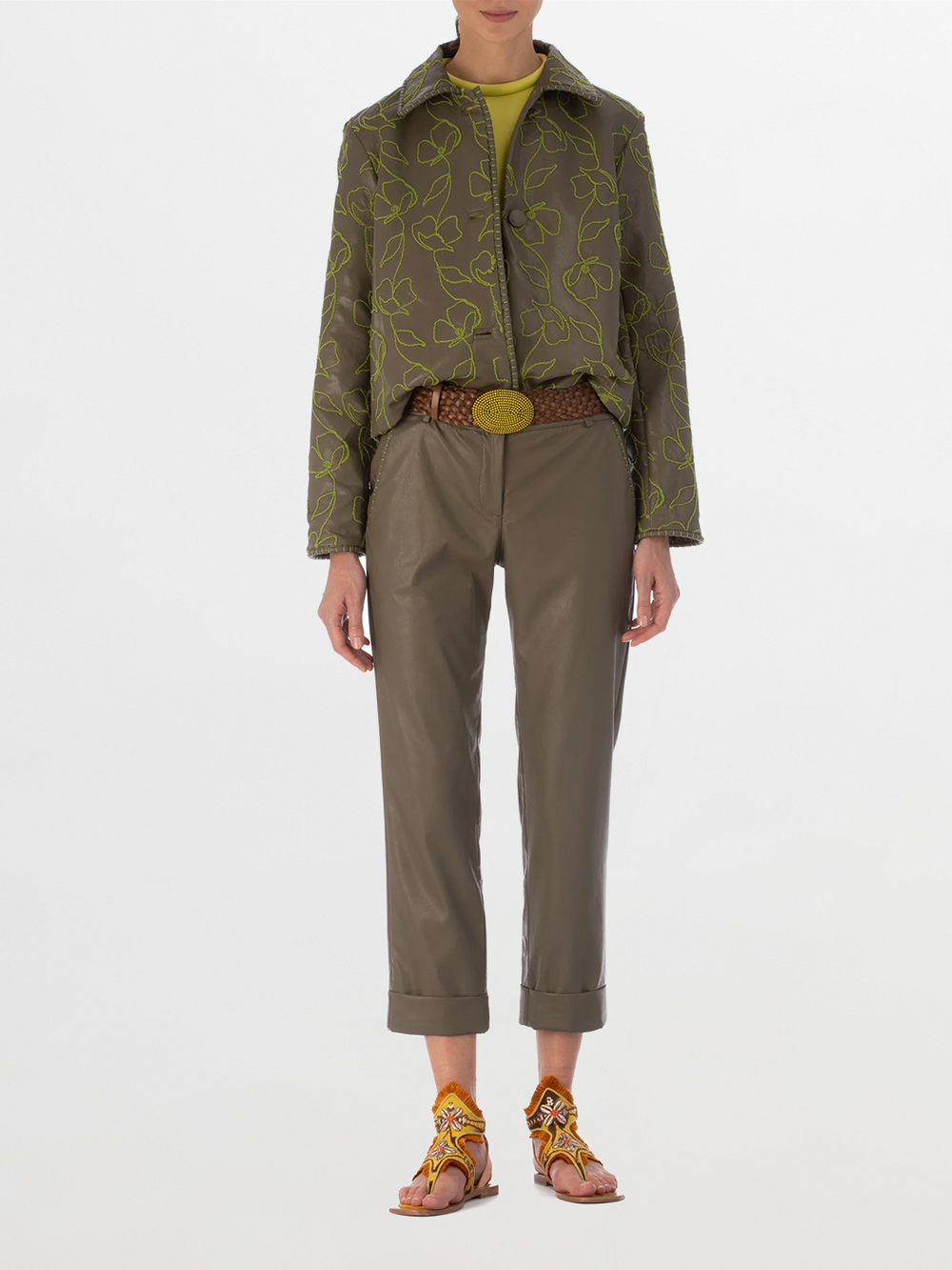 Explore the Columba Jacket in Forest Green, crafted from embroidered ecoleather. It showcases lime green floral embroidery, a chic collar, a button-down front, and long sleeves for an elegant mix of classic style with striking embroidery.