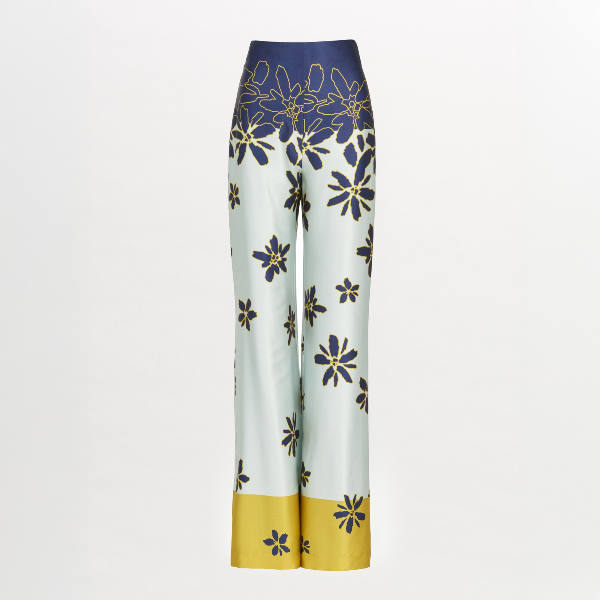 The Como Pant Navy Citrine features a high-waisted, wide-leg silhouette in luxe silk with a navy citrine floral print on white and a bold yellow band at the flared hem.