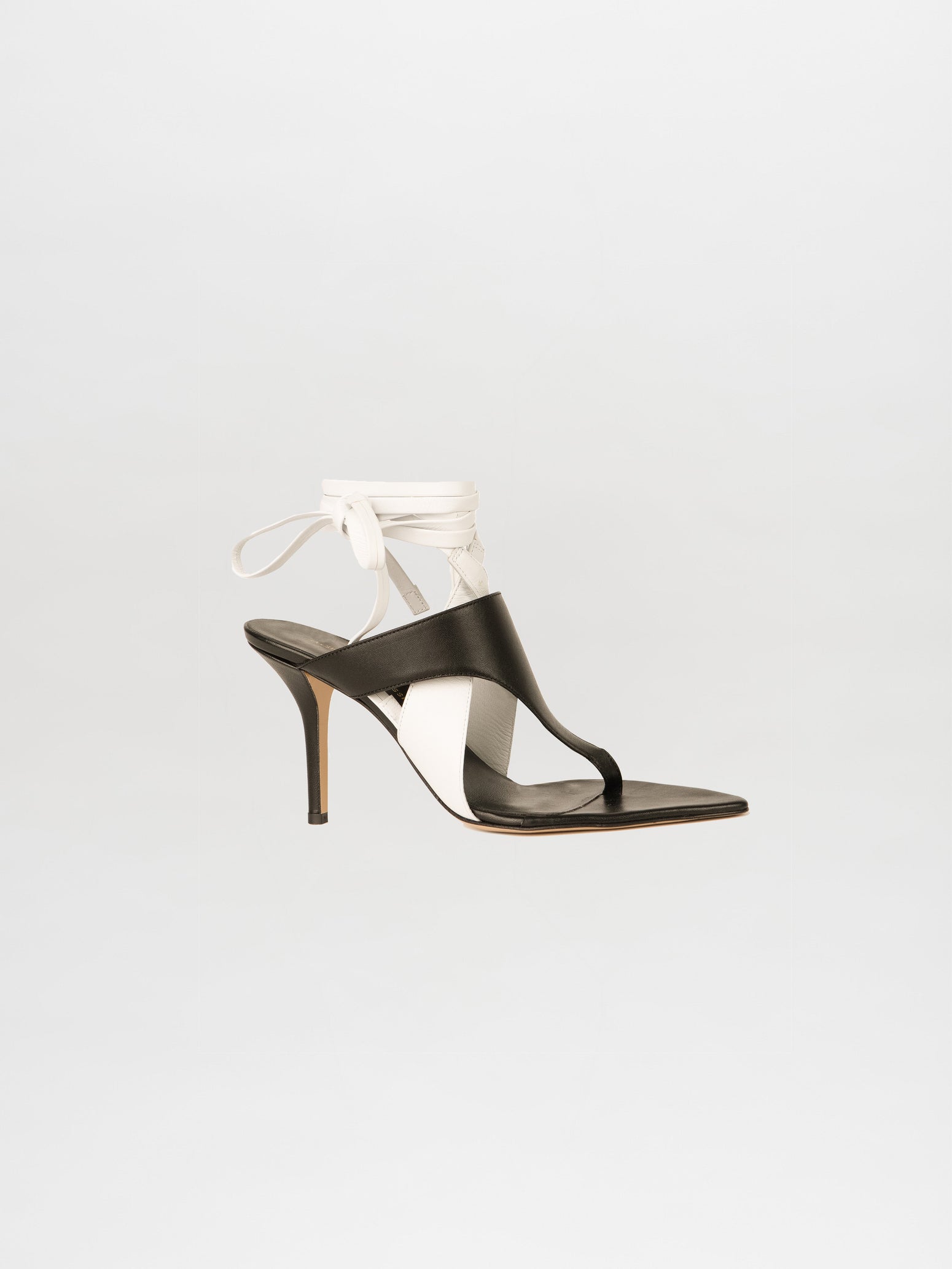 Domenico Heels Black/White made from Italian leather with ankle straps on a white background.