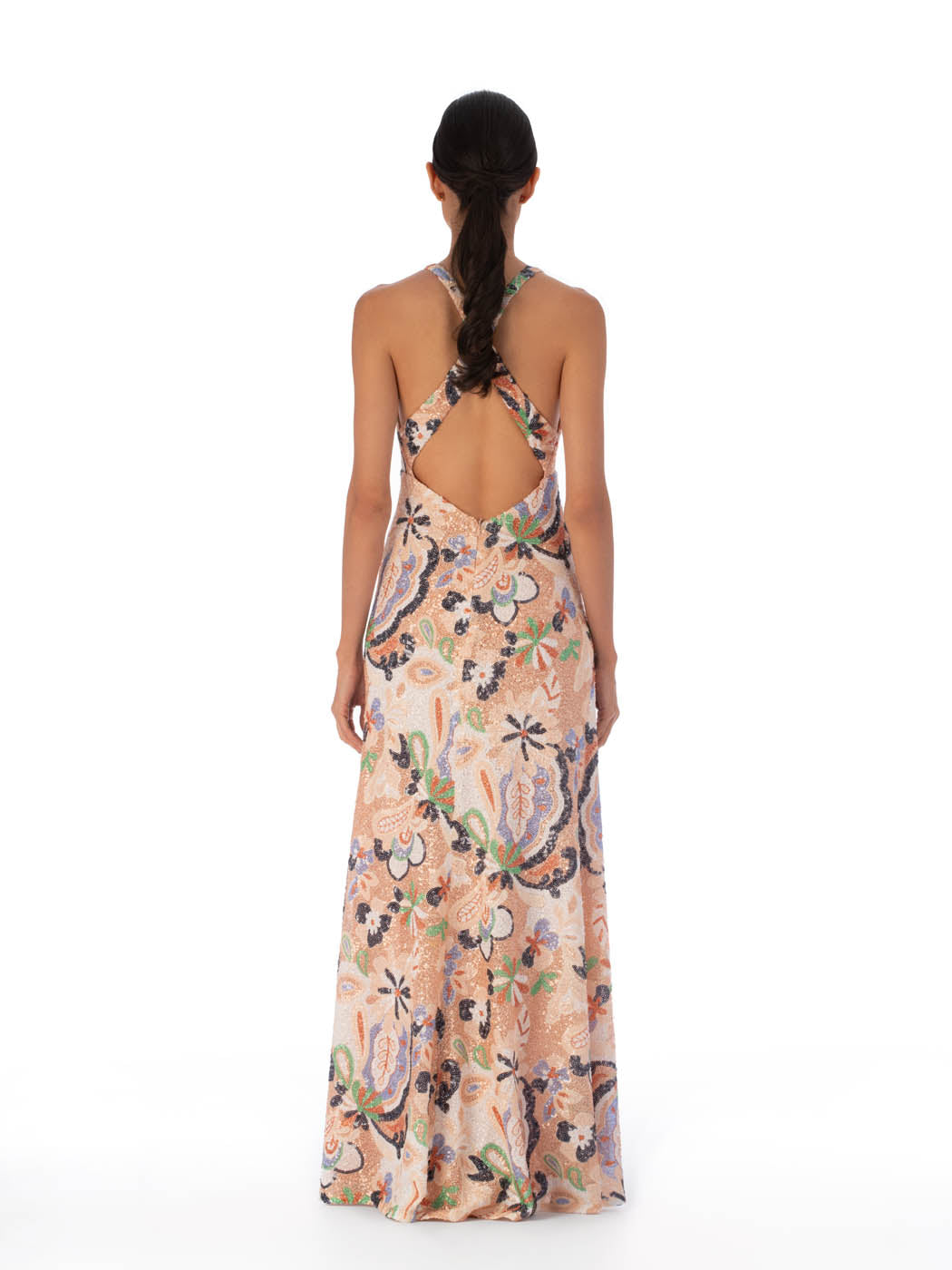 Sleeveless v-neck maxi Daira Dress Multi Pastel Sequins with a pastel floral print on a light peach background, featuring thin straps and a fitted silhouette.