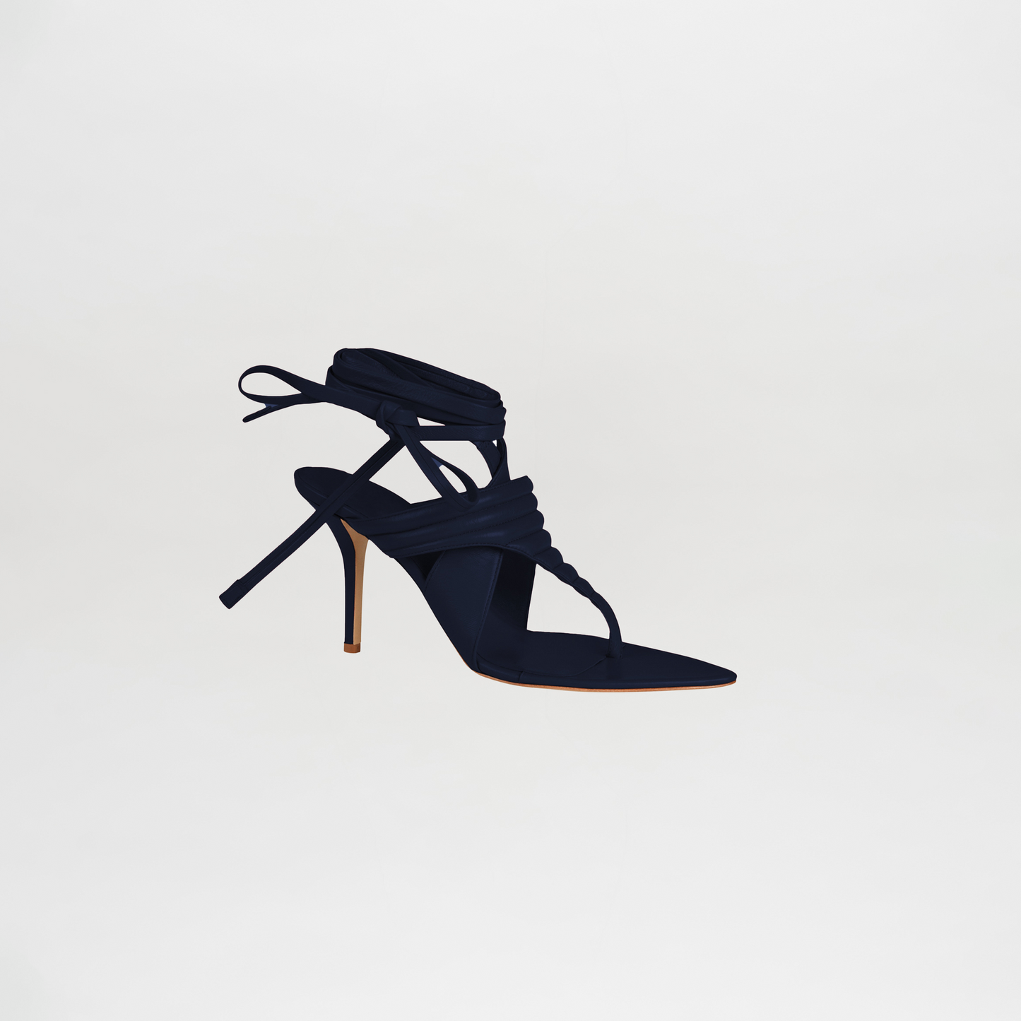 Navy blue high-heeled sandal with strappy design on a light gray background