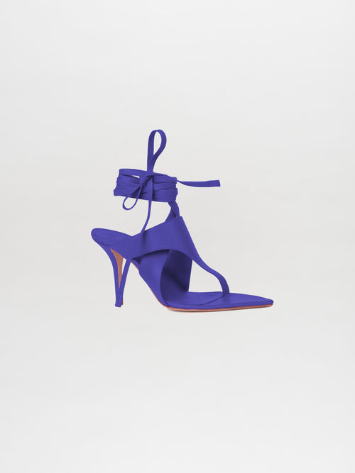 The Domenico Heels Violet features a luxurious Italian leather design with a purple hue and an ankle wrap detail, crafted by GIA Couture, displayed on a white background.