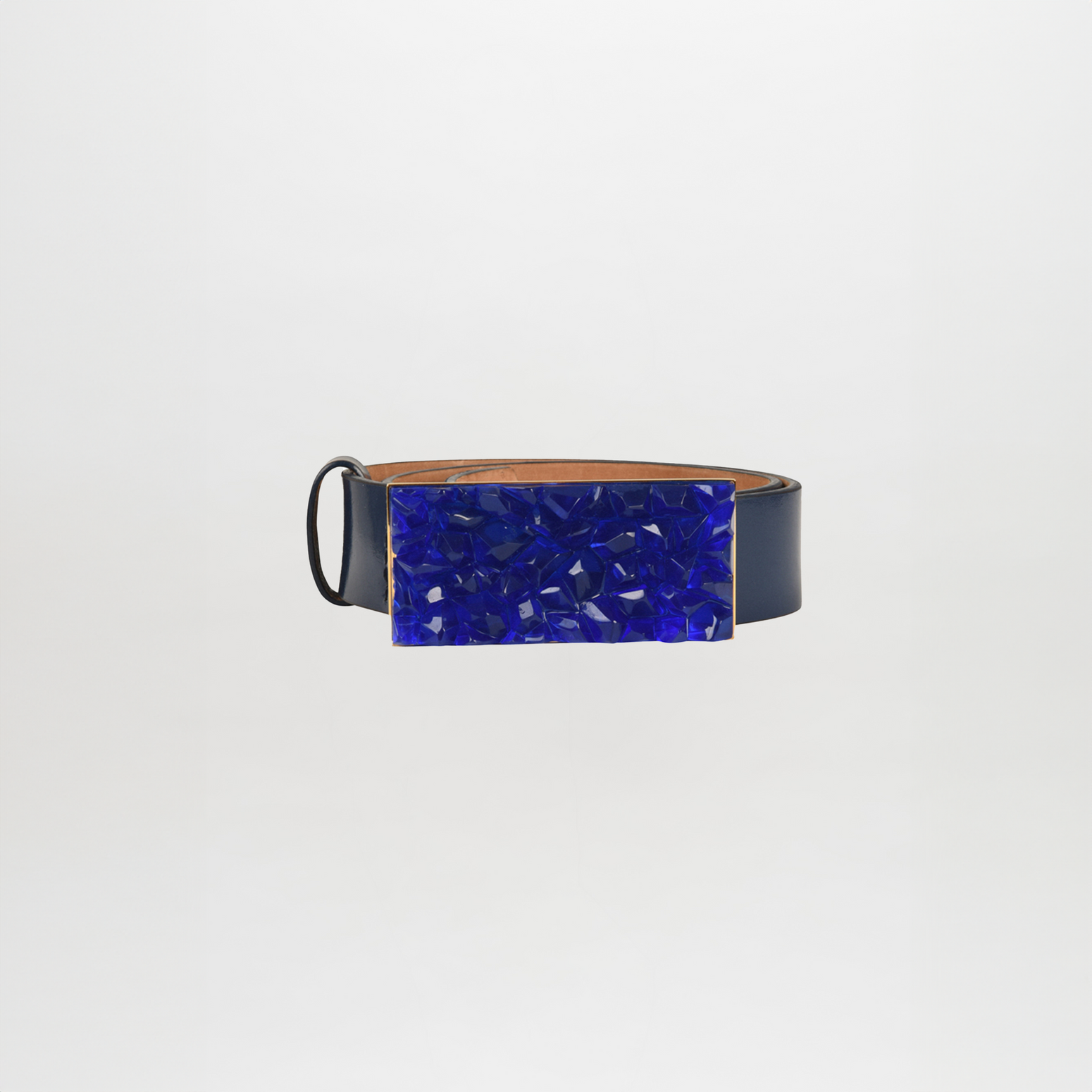 The Dora Belt is a black leather accessory showcasing an Italian resin buckle with a large, rectangular blue texture against a plain white background.