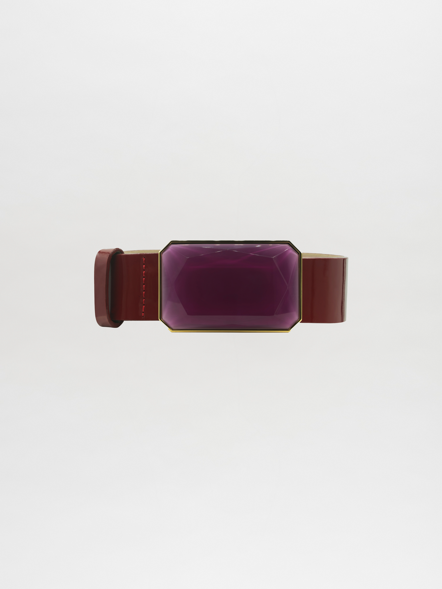 The Dora Belt Rouge, showcasing a maroon band with a striking large geometric purple gem, is set against a plain white background, ready to ship and elevate any ensemble with its elegant touch.