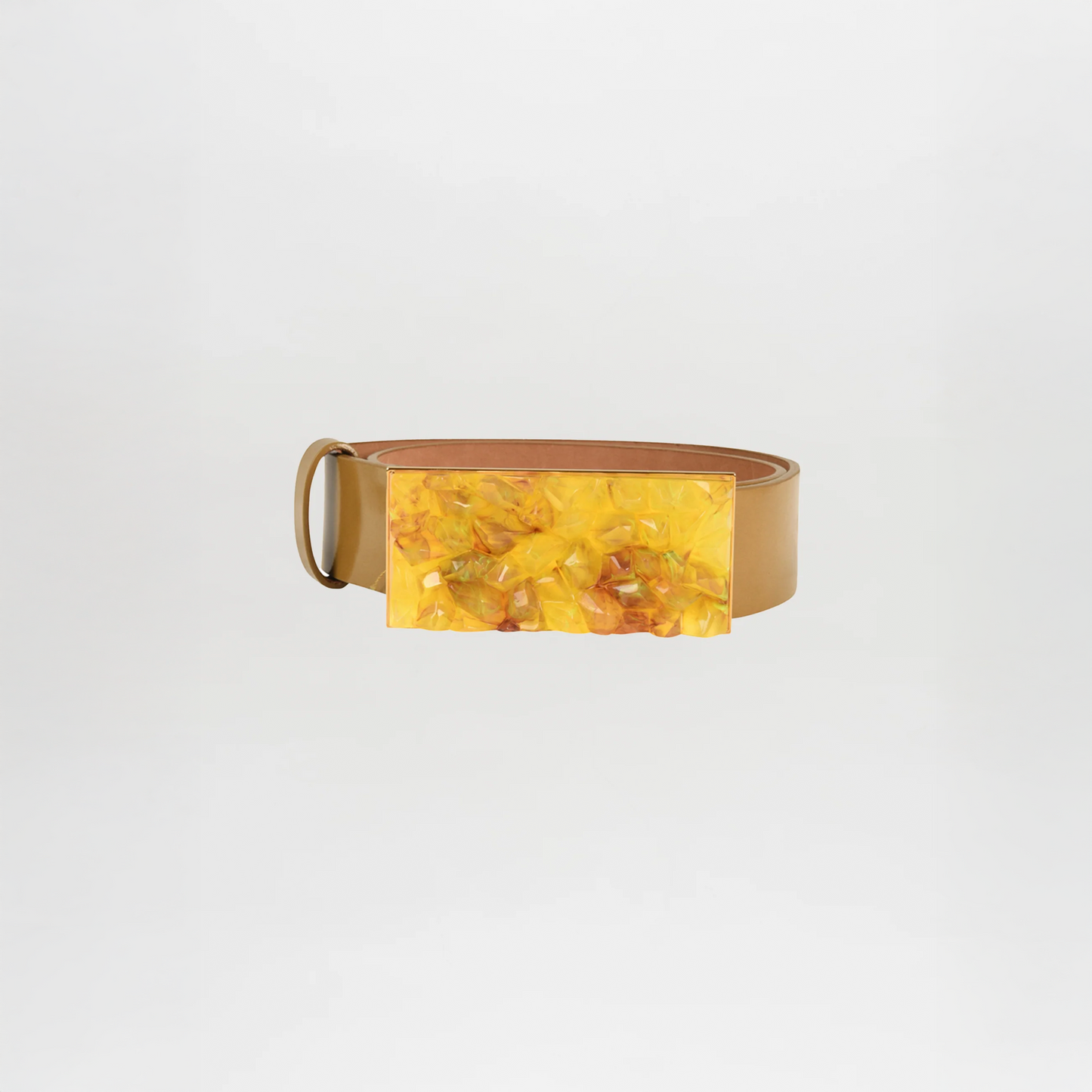 The Dora Belt Mustard is a tan leather statement belt featuring a large rectangular yellow marbled buckle, inspired by Silvia Tcherassi, shown on a plain white background.