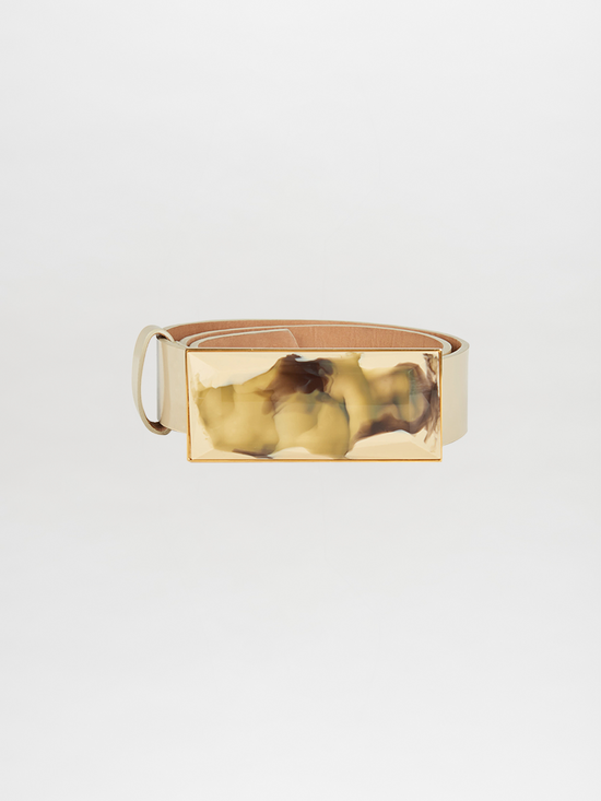 The Dora Belt Pastel Yellow from the Silvia Tcherassi Collection is a statement piece, featuring a brown leather strap with a rectangular, marbled beige and brown buckle.