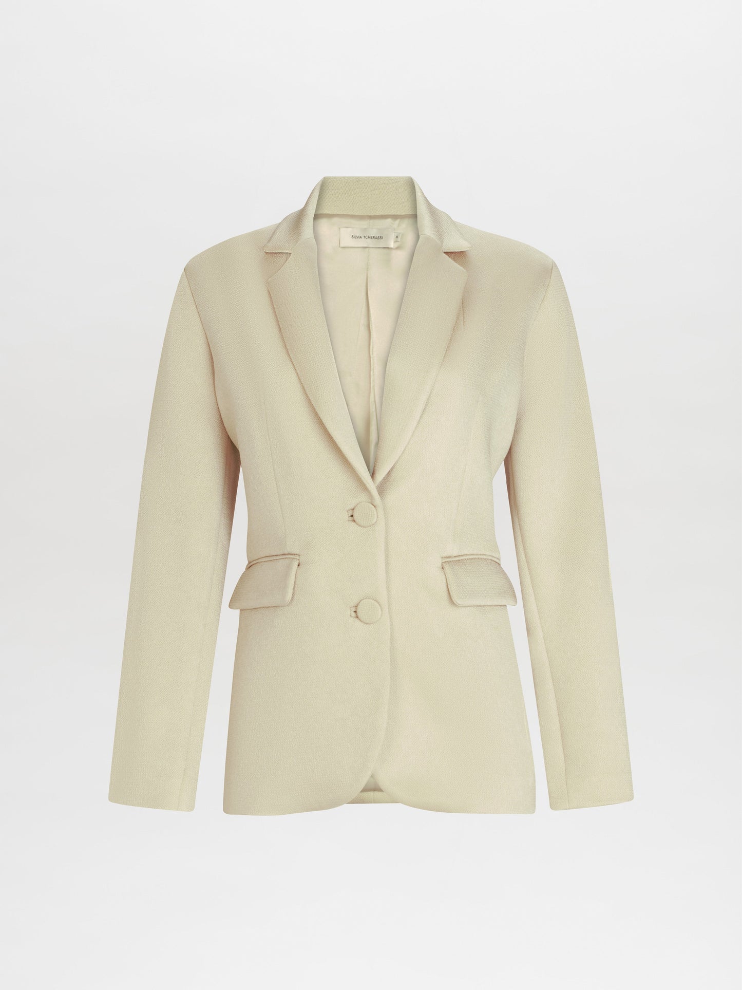 The Echo Jacket is a beige women's blazer with a tailored fit, featuring two front buttons and flap pockets, displayed against a plain white background.