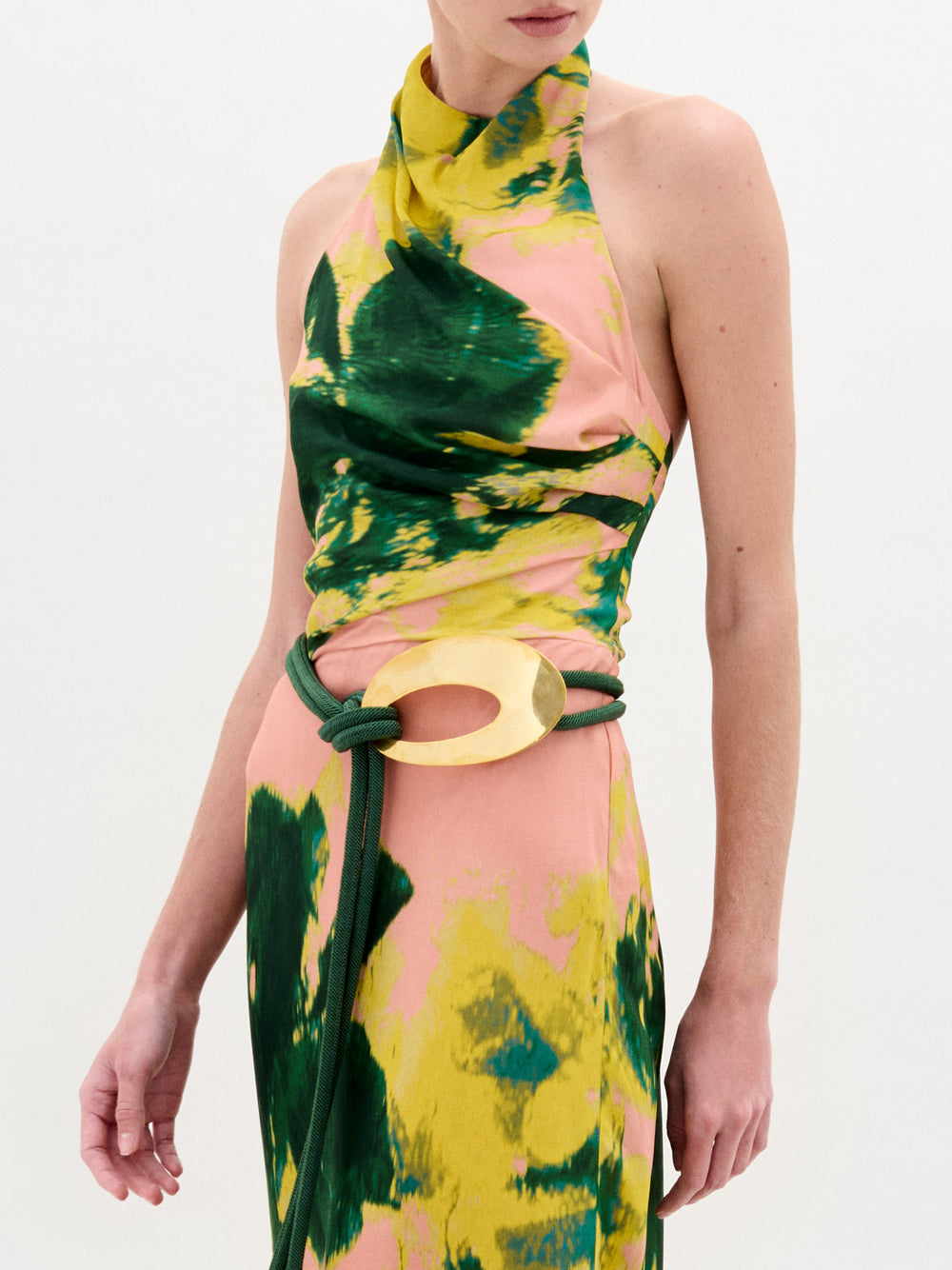 A person wearing the Ellis Dress in color Floral on a white background.