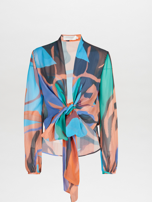 A navy blue Honey Blouse Pastel Multi Swirls with a colorful print on it.