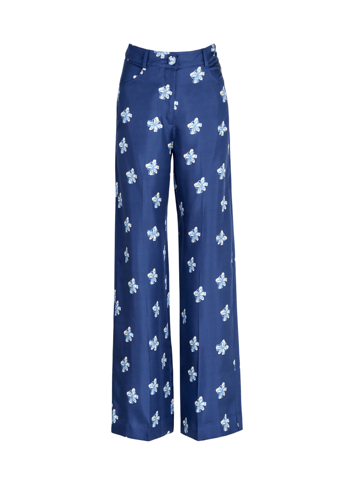 A woman's Emine Pant Navy Bloom with white floral patterns.