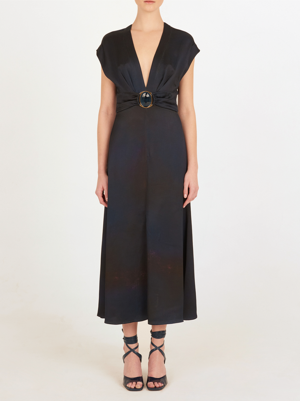 An elegant Emmeline Dress Navy with a buckle on the front.