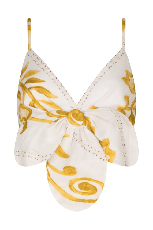 A Flor Top Multicolor Floral Print bikini top with a bow and gold accents.