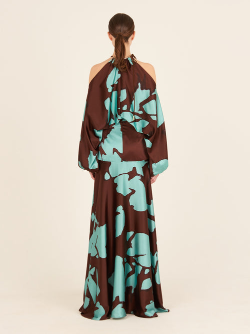 A unique print Bahar Dress Celeste Cacao in silk with a blue and brown floral design.