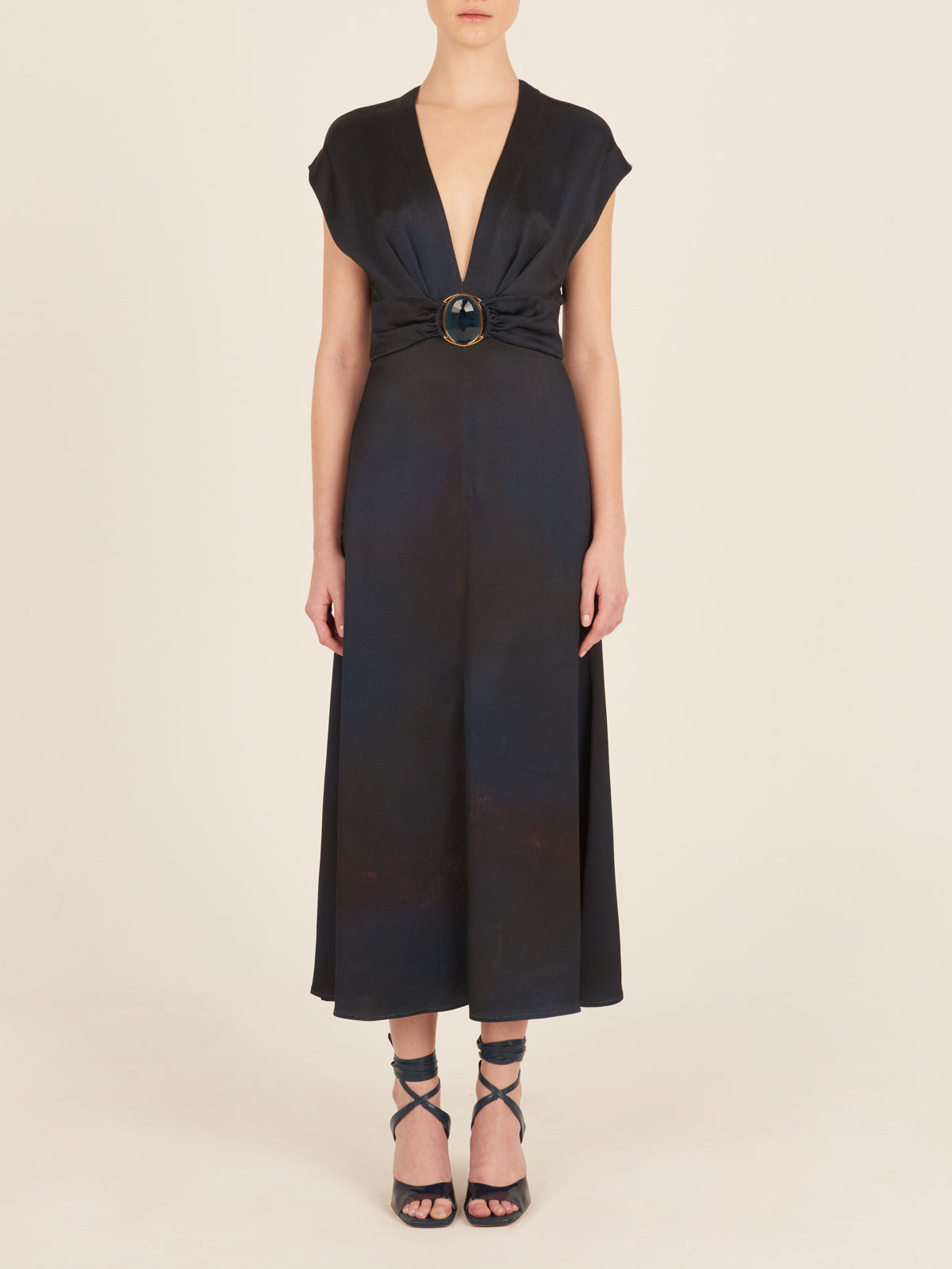 An elegant Emmeline Dress Navy with a buckle on the front.