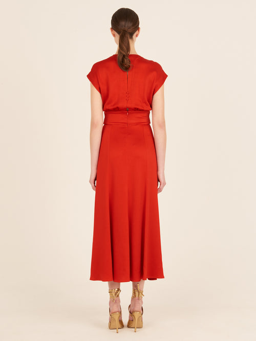 Emmeline Dress Rouge, with a belt that features a plunging neckline.