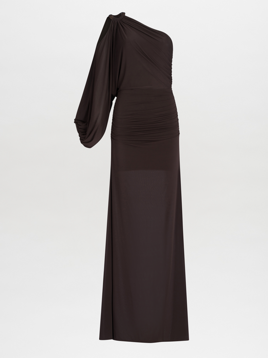 Woman in a Farah Dress Brown, a one-shoulder evening gown with leather ring detailing, posing in a studio setting.