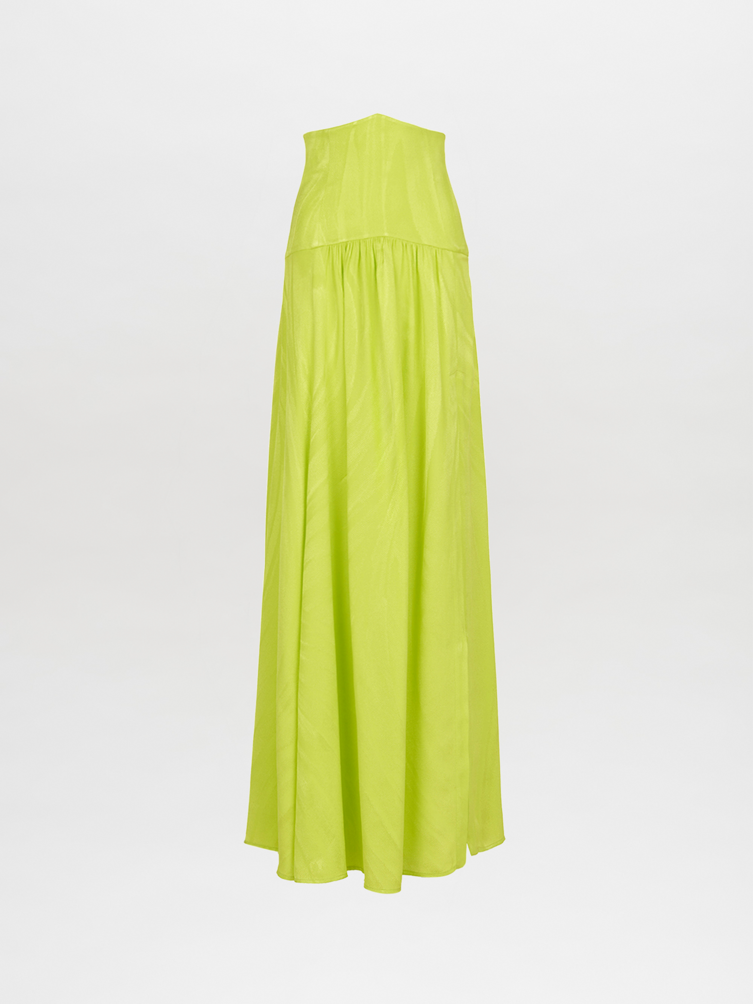 A person wearing the Febe Skirt Verde Lime, which features a cut-out design and an avant-garde, elegantly flowing skirt, making it a statement piece.