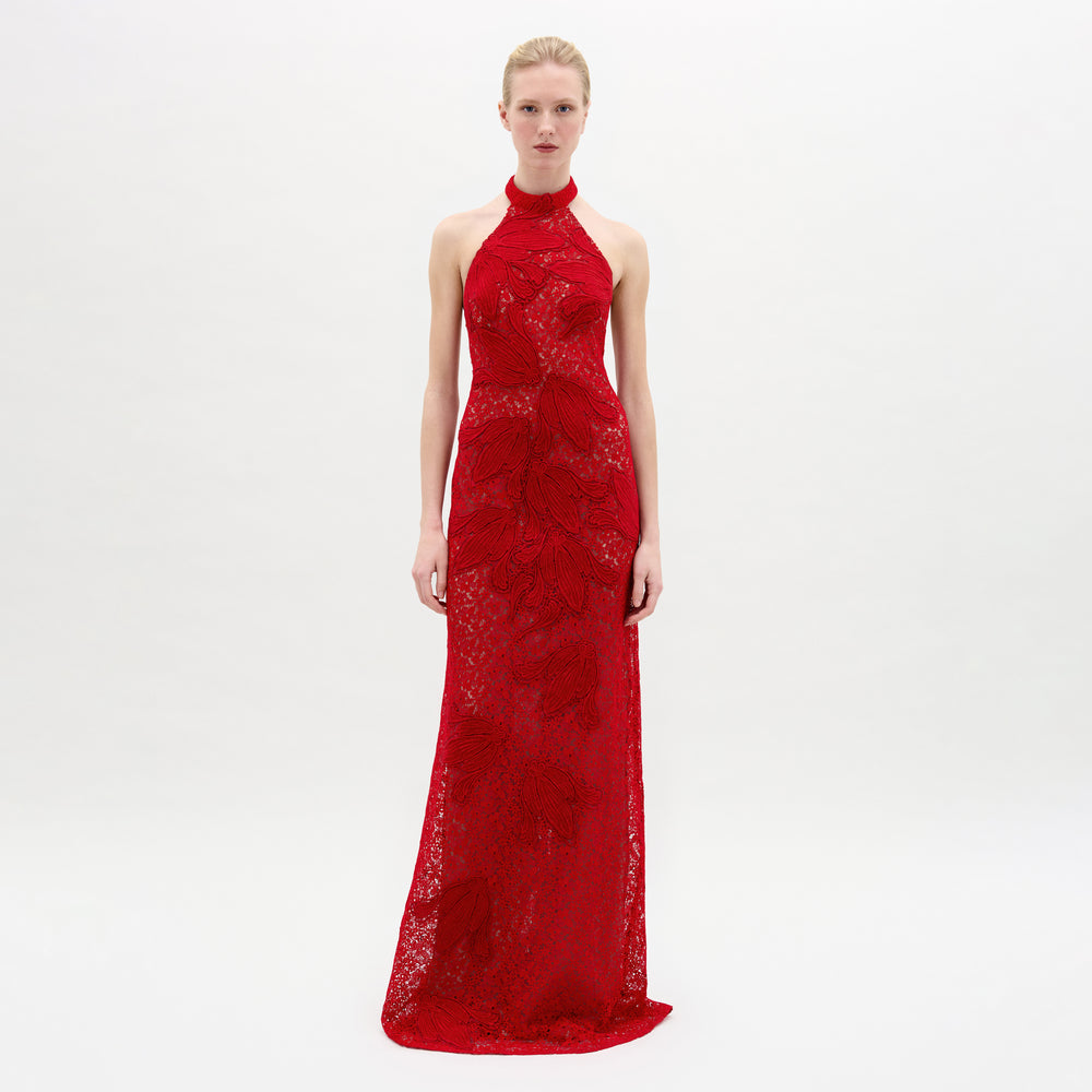 A woman wearing the Gardenia Dress in color Rouge on a white background.