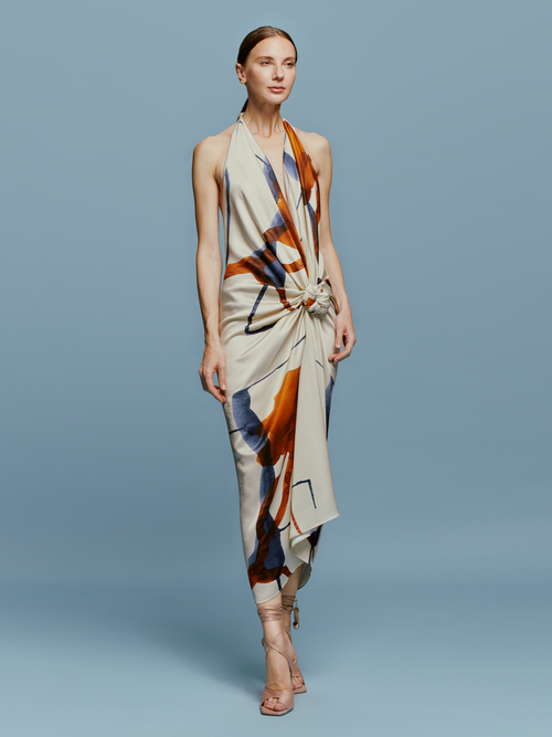 A model showcasing a Guadalupe Dress Cobalt Copper Abstract.