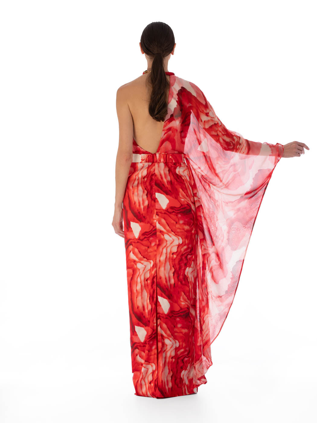 Mannequin dressed in a Gael Dress Multi Abstract Rouge, featuring a removable belt with marbled resin buckles, high neckline, and a lightweight chiffon drape on