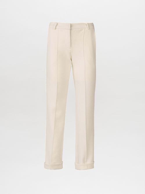 A Garmet Pant White with straight-leg cropped design, featuring a crease down the front and slightly cuffed hems for a tailored appeal.