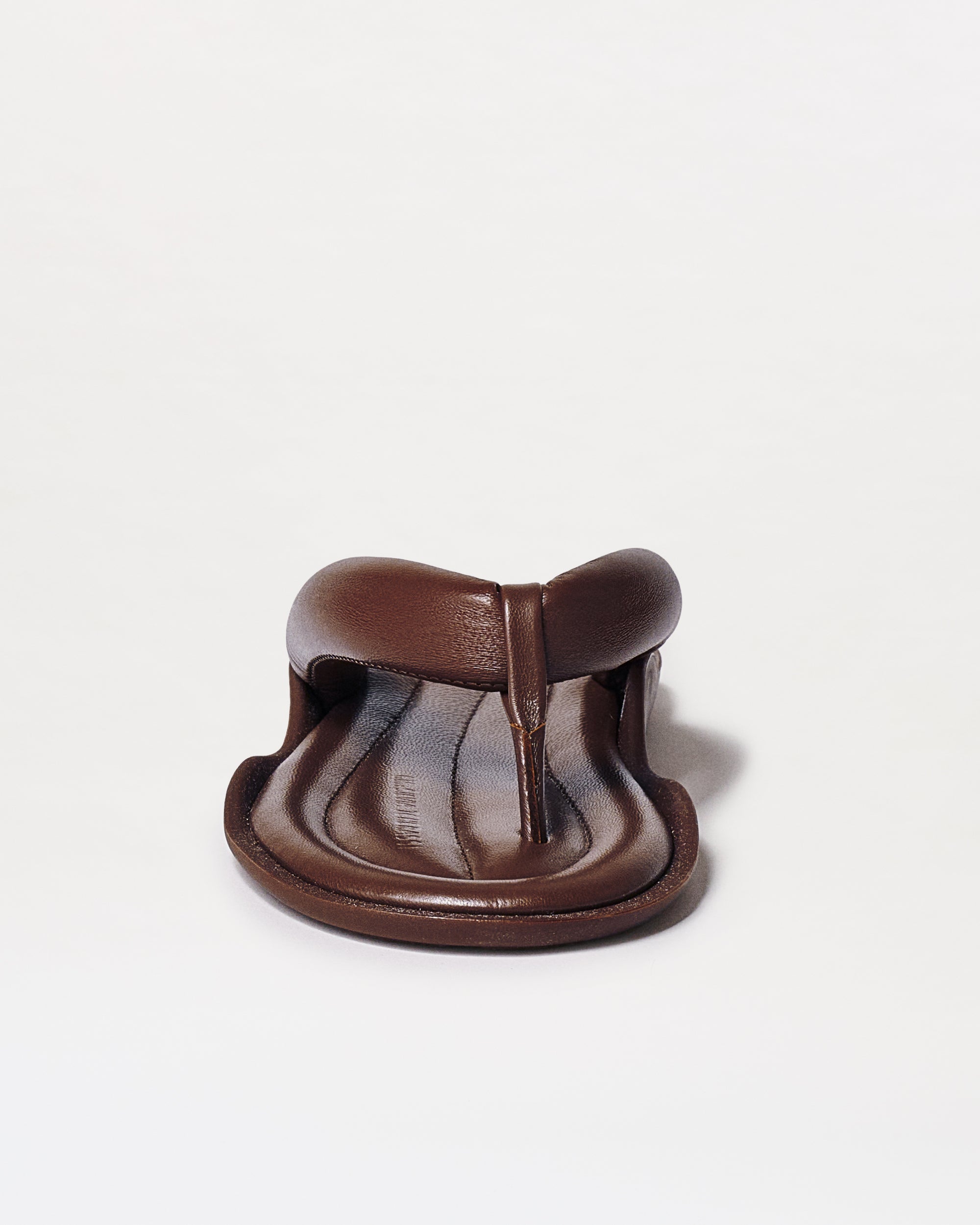 Front view of Harper Sandals in brown leather, featuring a cushioned footbed and toe loop design, displayed against a plain white background.