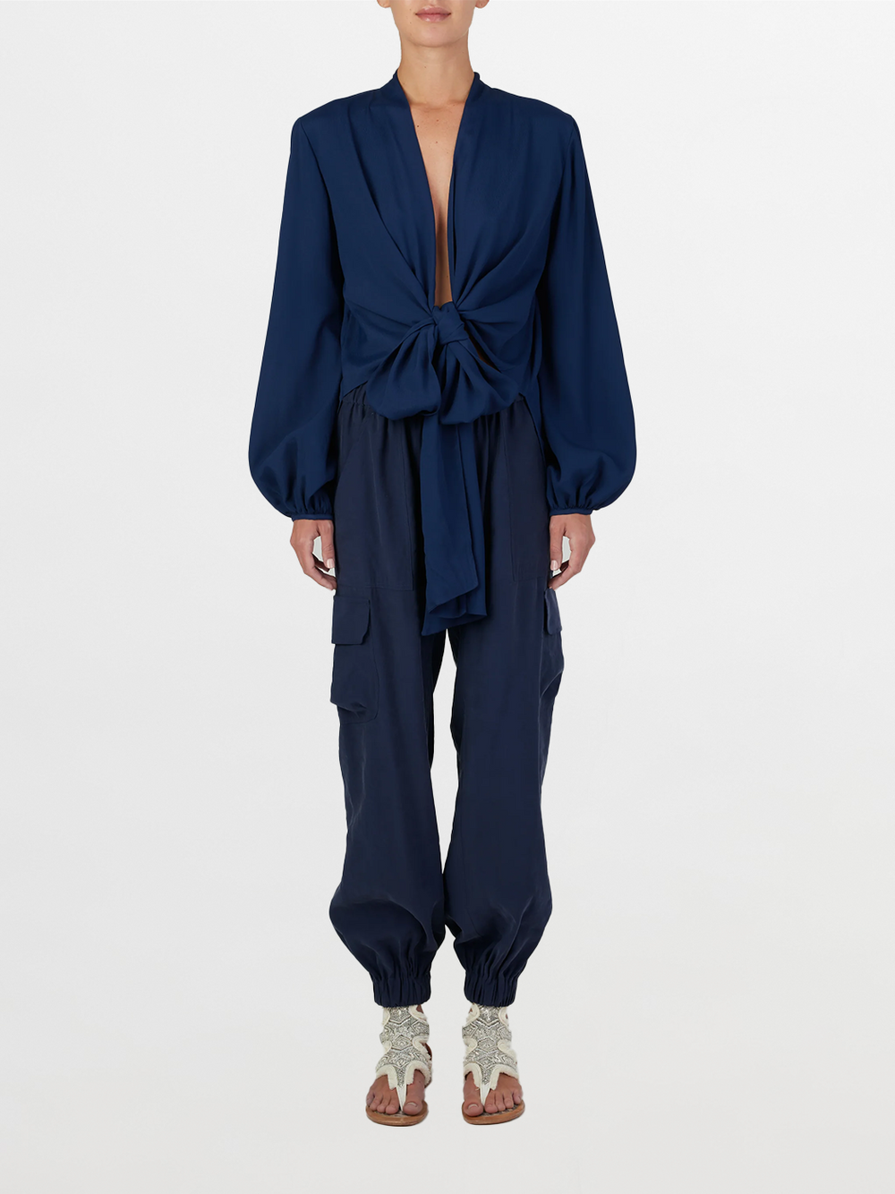 A Honey Blouse Navy with a tie at the neck, designed in a flattering cut.