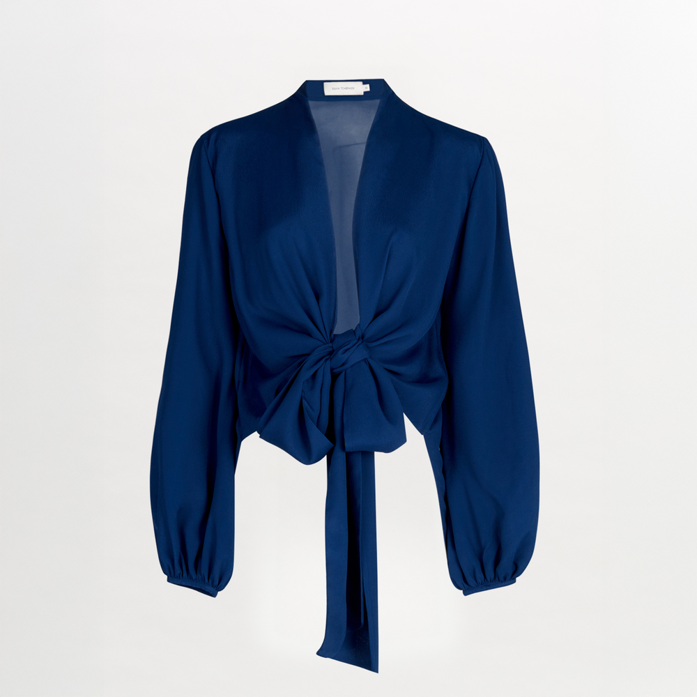 A Honey Blouse Navy with a tie at the neck, designed in a flattering cut.