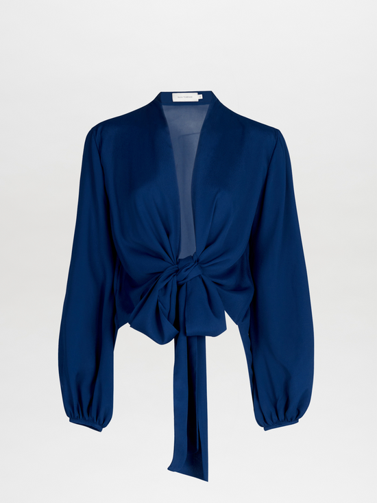 A Honey Blouse Navy with a tie at the neck, designed in a flattering cut.