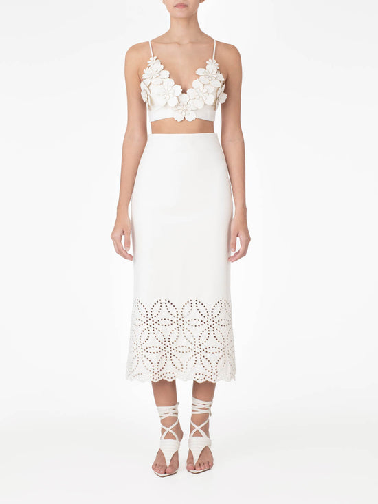 Atira Skirt Pearl high-waisted midi skirt with laser-cut floral hem design, isolated on a white background.