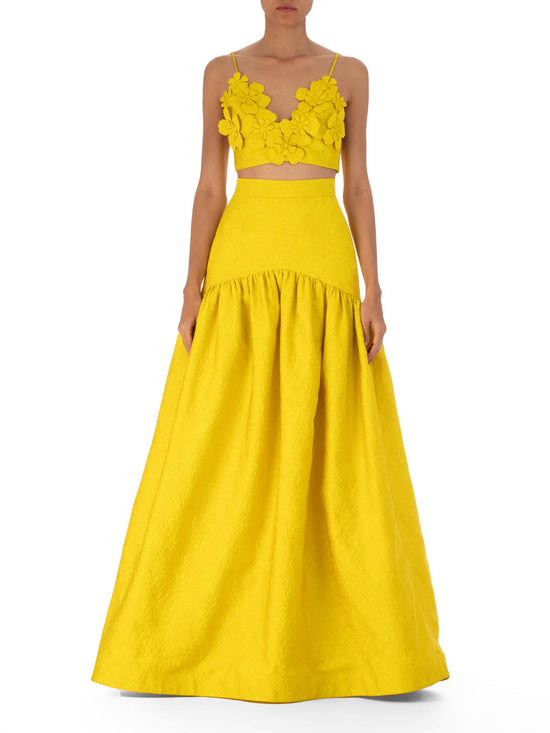 Yellow halter-neck evening gown with a full Eider Skirt Limoncello, displayed on a plain white background.