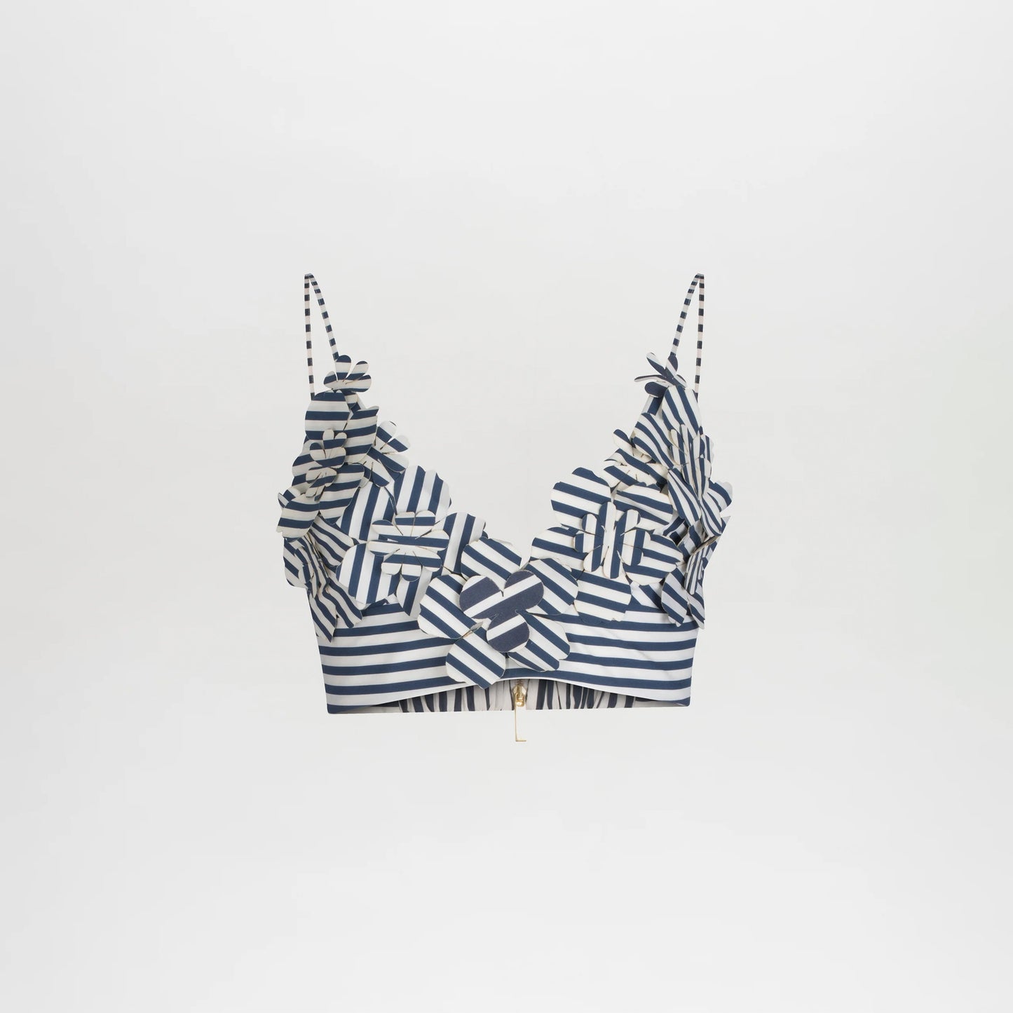 The Ibbie Top is a blue and white striped crop top with thin straps and ruffled 3D accents on the neckline and chest, offering a playful, fitted style. Shown against a plain white background.