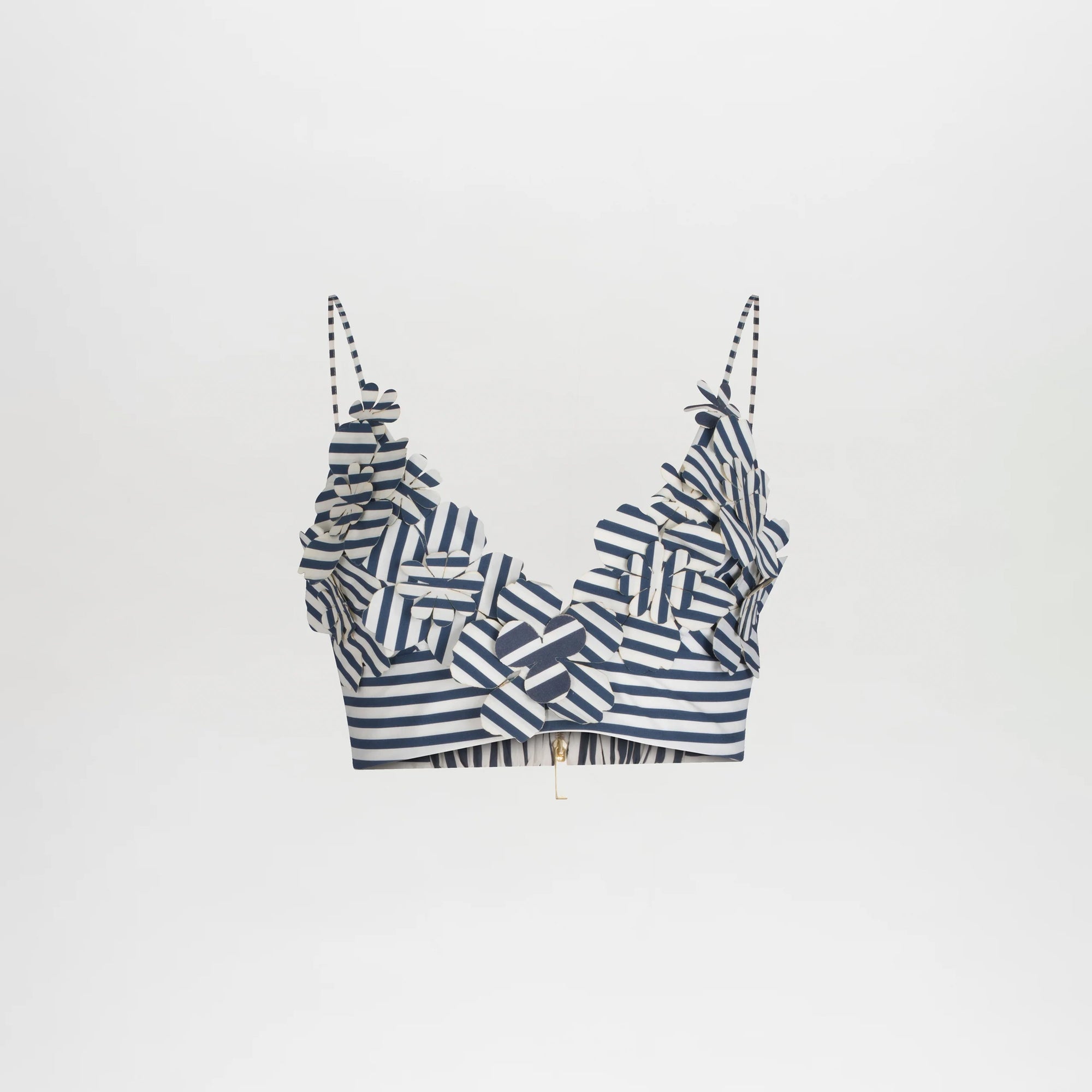 The Ibbie Top is a blue and white striped crop top with thin straps and ruffled 3D accents on the neckline and chest, offering a playful, fitted style. Shown against a plain white background.
