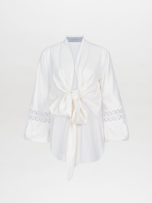 Irme Blouse White with a unique neckline featuring a bow on the front.