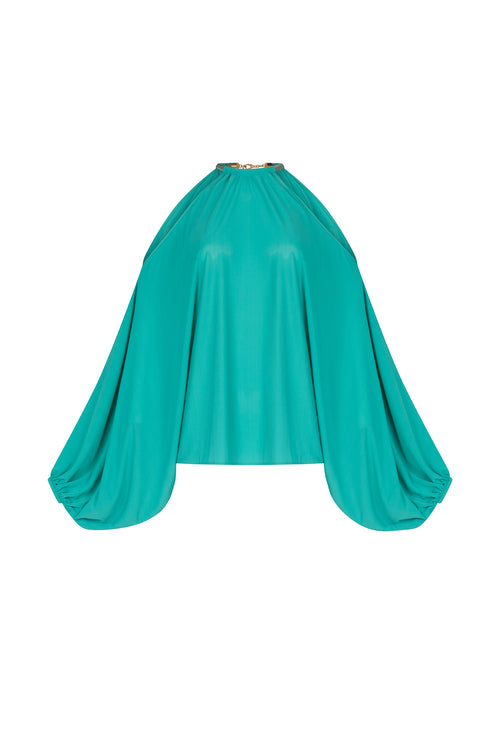 A Janina Blouse Aqua with a metallic jewelry detail around the neck.