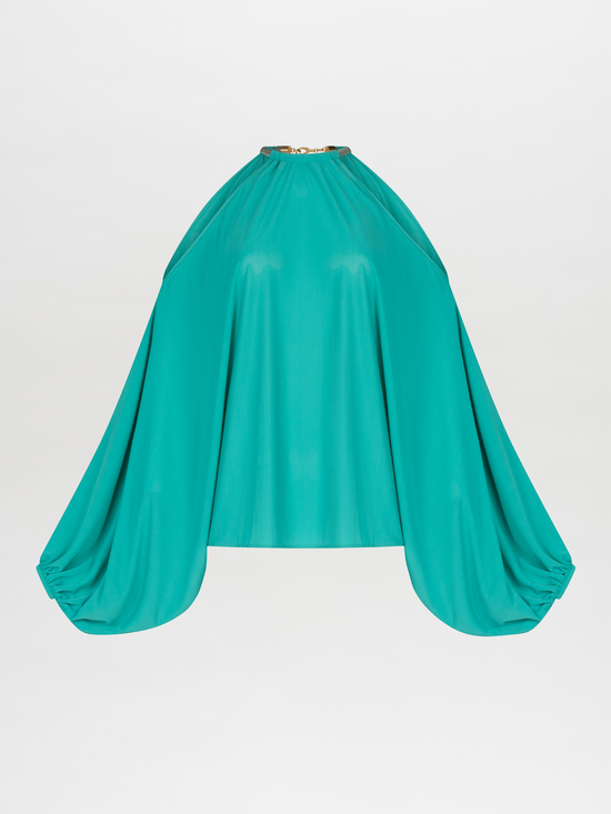 A Janina Blouse Aqua with a metallic jewelry detail around the neck.