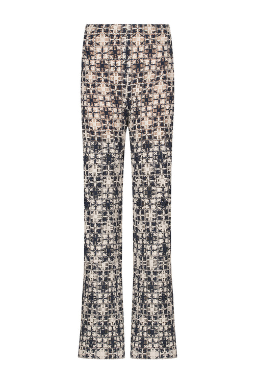 A Joan Pant Navy White Crochet with a pattern in lace fabric.