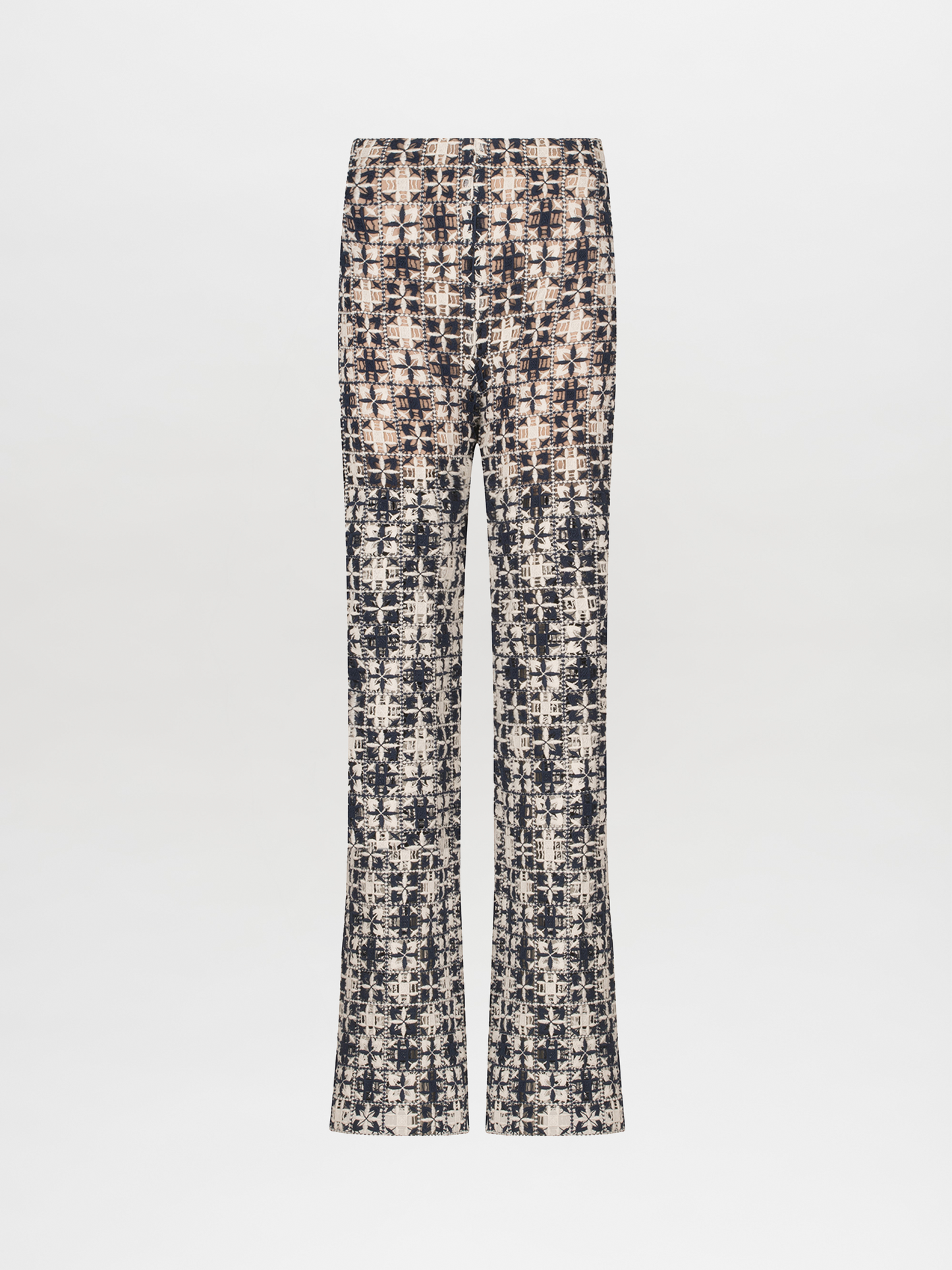 A Joan Pant Navy White Crochet with a pattern in lace fabric.